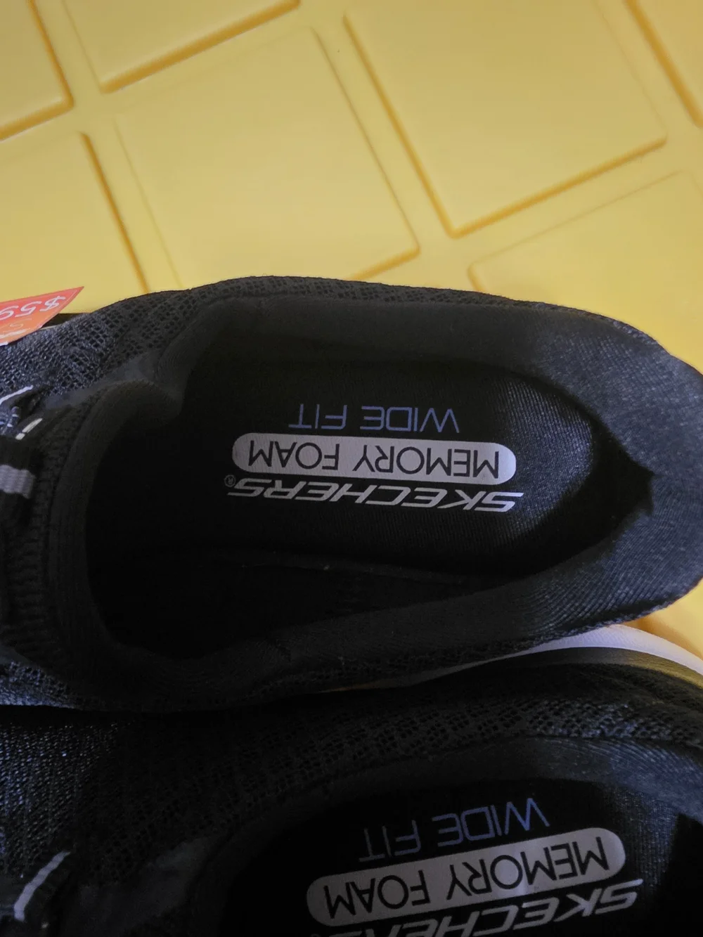 Skechers Black Slip-On Athletic Sneakers with White Soles